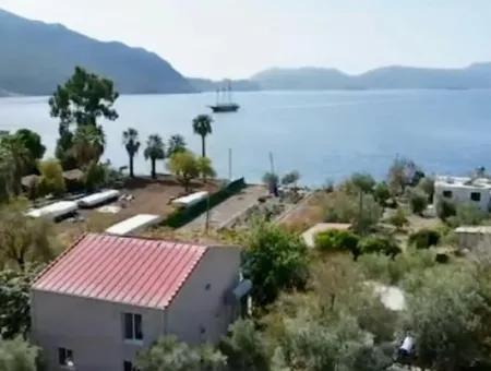 Marmaris Söğüt Mahallesi Denize Sıfır 2000M2 Arsa Satılık Müstakil Ev.önüne Tekne Bağlamaya Uygun.